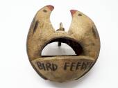 Coconut lovebird feeder.