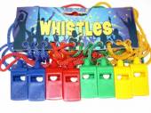Coloured whistles on cord.